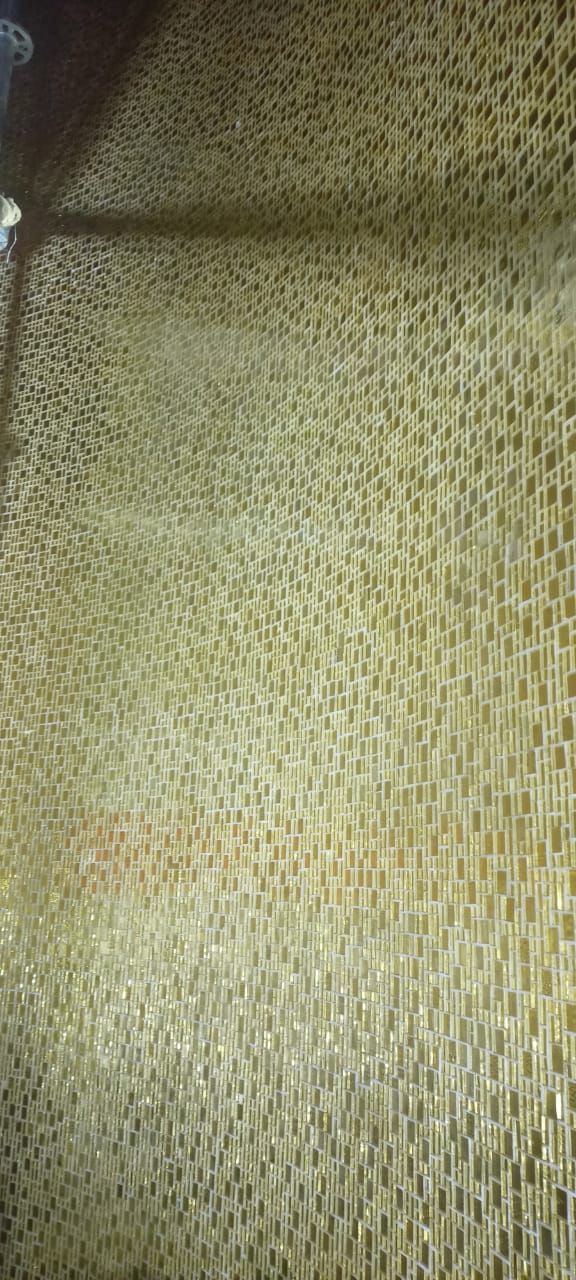 Close view of a gold leaf mosaic field showing varied reflections