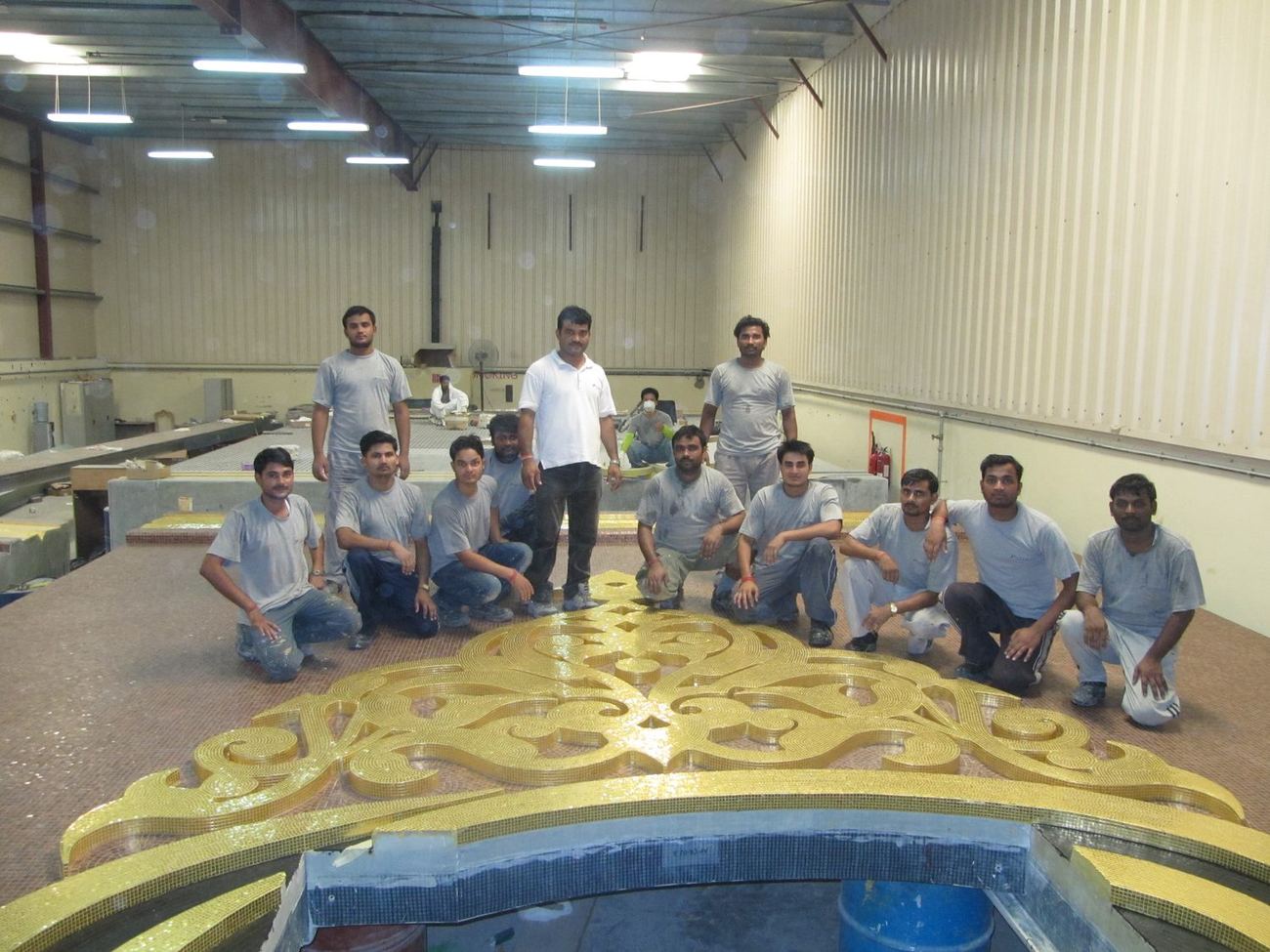 The installation crew photographed with a finished mosaic dome