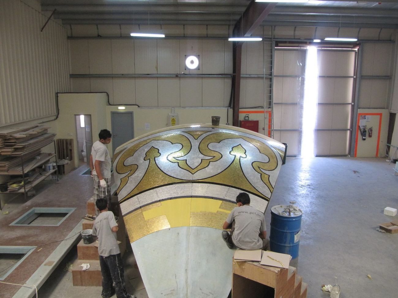Large curved mosaic panel being finished in the workshop